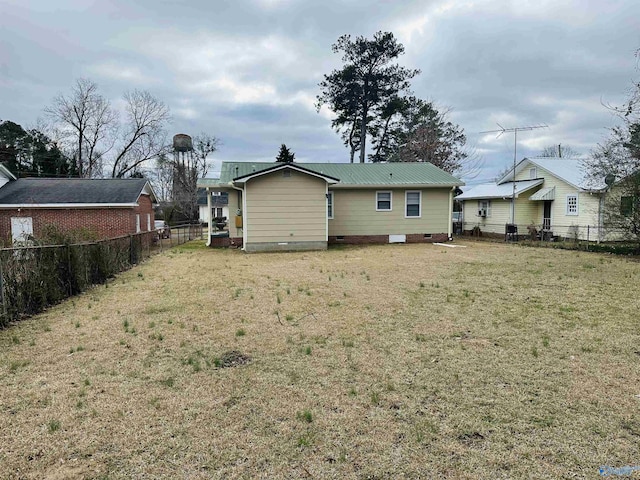 back of house with a yard