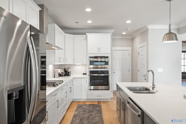 kitchen featuring light countertops, tasteful backsplash, a sink, and stainless steel appliances