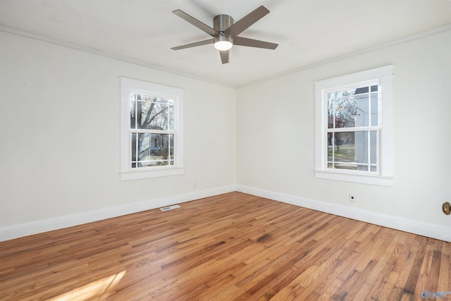 unfurnished room featuring crown molding, ceiling fan, and hardwood / wood-style flooring