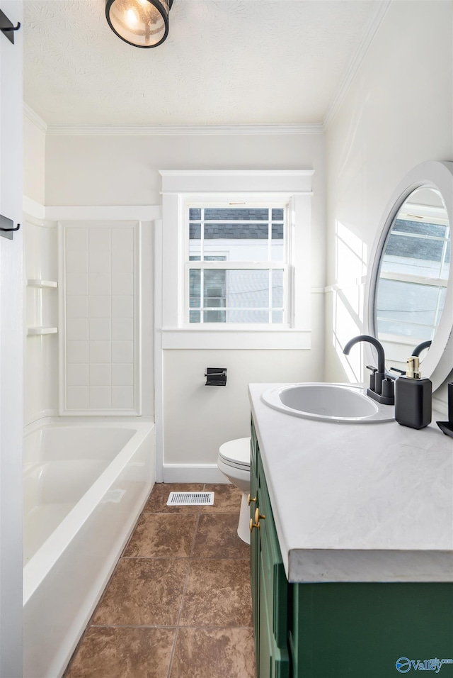 bathroom with vanity, toilet, and ornamental molding