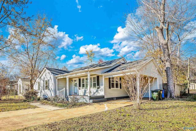 single story home with a front lawn and a porch