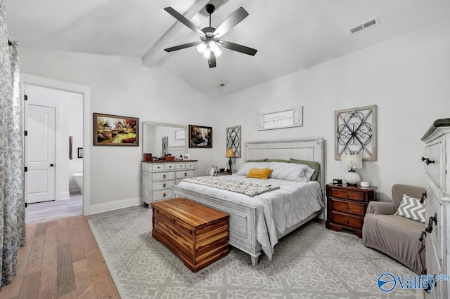 bedroom with visible vents, light wood-style floors, baseboards, ceiling fan, and lofted ceiling with beams
