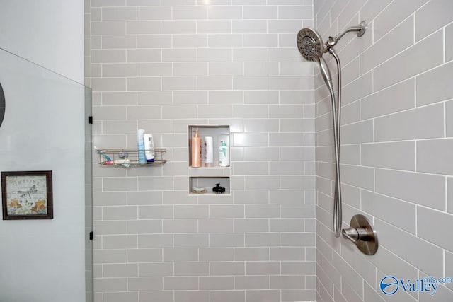 bathroom with tiled shower