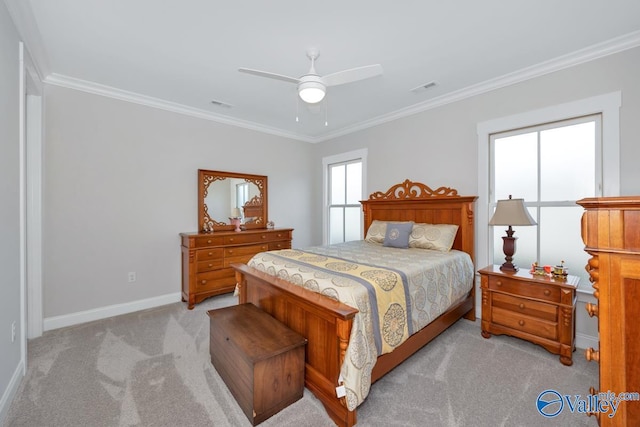bedroom with visible vents, ornamental molding, baseboards, and light carpet