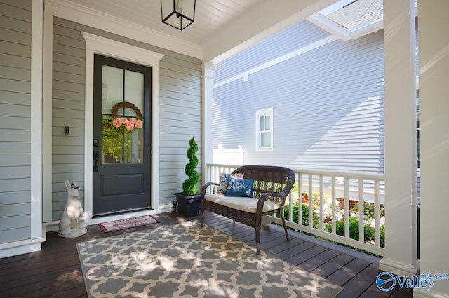 doorway to property with covered porch