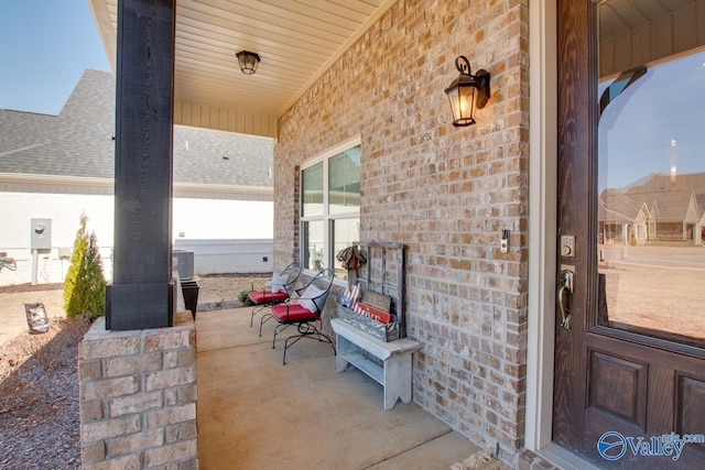 entrance to property with brick siding