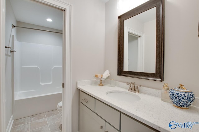 full bathroom featuring tile patterned flooring, vanity, toilet, and bathing tub / shower combination