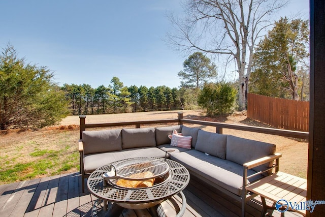 wooden deck featuring fence and an outdoor living space