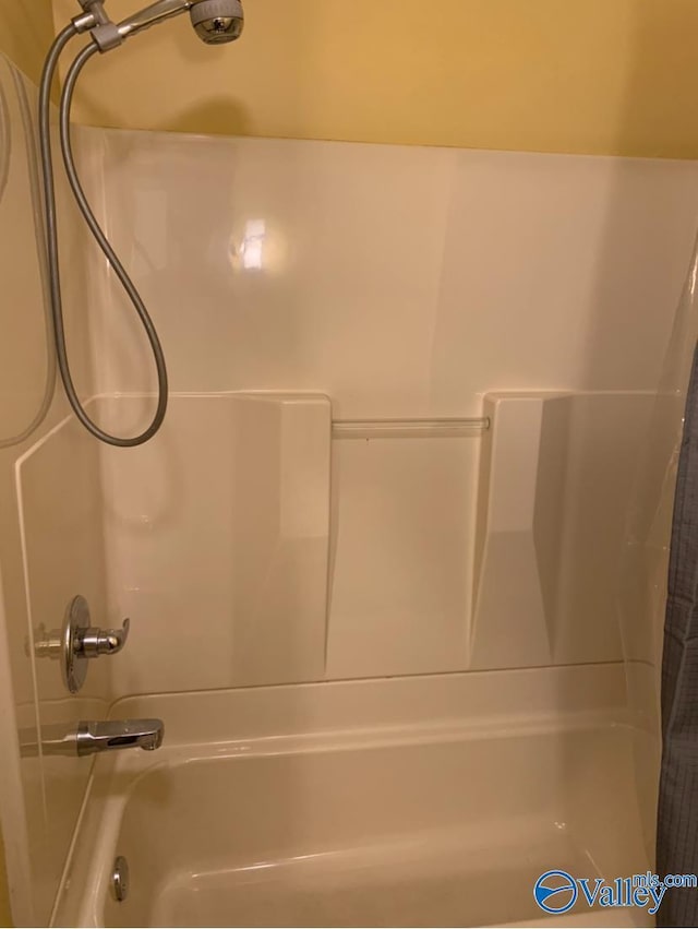 full bath featuring shower / tub combo with curtain