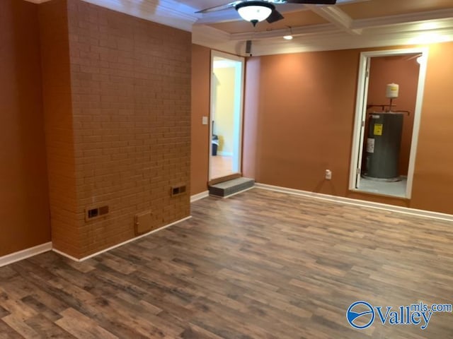 spare room featuring baseboards, coffered ceiling, brick wall, dark wood-type flooring, and water heater