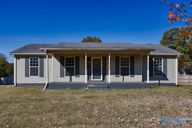 single story home featuring covered porch and a front yard