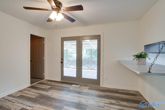 doorway to outside with ceiling fan and wood-type flooring