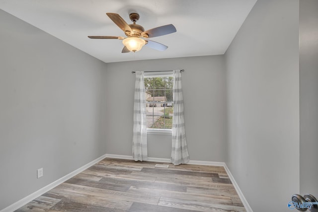 spare room featuring ceiling fan and light wood-type flooring