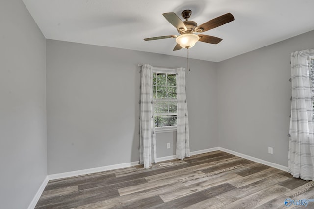 unfurnished room with ceiling fan and wood-type flooring