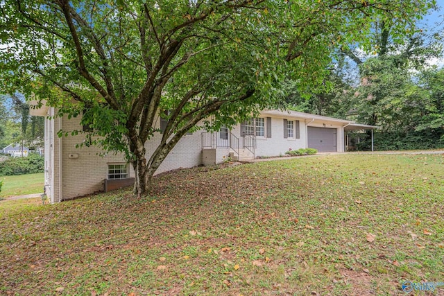 view of front of home with a garage and a front yard