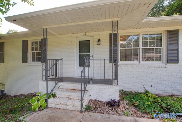 doorway to property featuring a porch