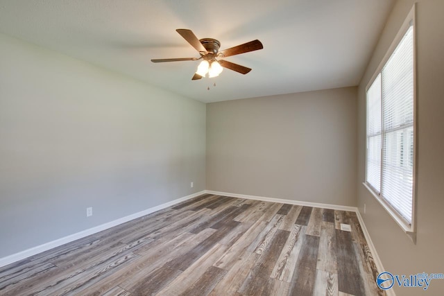 empty room featuring hardwood / wood-style floors and ceiling fan