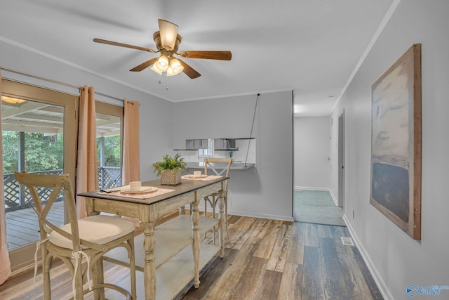 dining area with ceiling fan, ornamental molding, and hardwood / wood-style floors