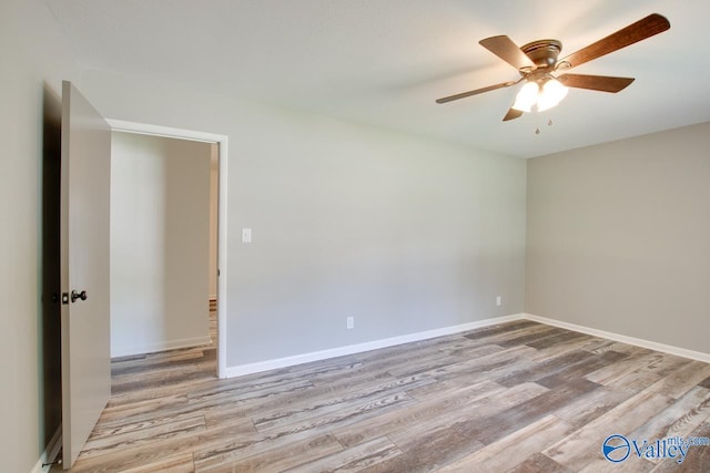 spare room featuring ceiling fan and light hardwood / wood-style flooring