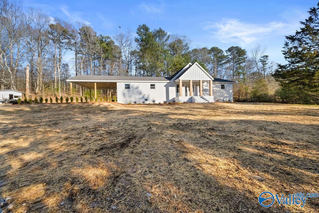 view of front of property with a carport