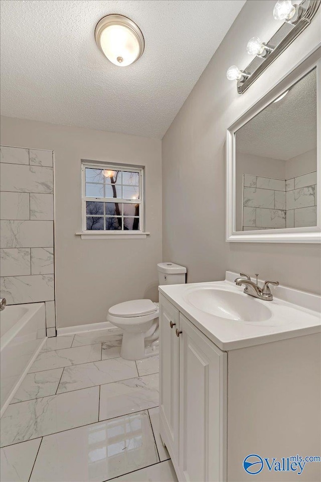 full bathroom with toilet, vanity, shower / bath combination, and a textured ceiling