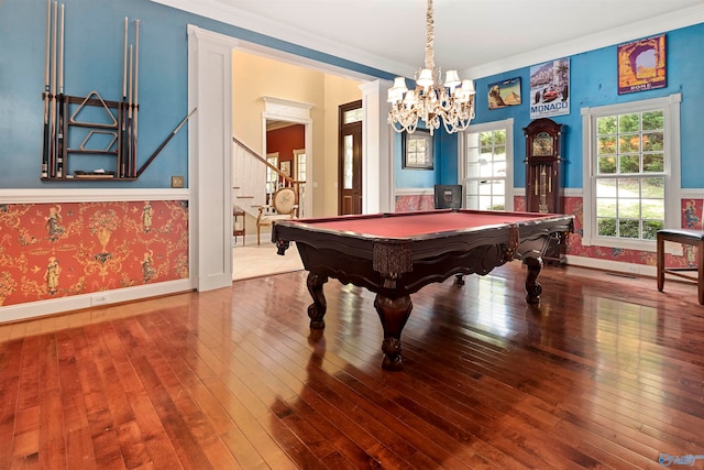 game room featuring ornamental molding, wood-type flooring, a notable chandelier, and pool table