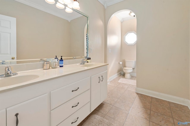 bathroom with double vanity, crown molding, tile patterned flooring, and toilet