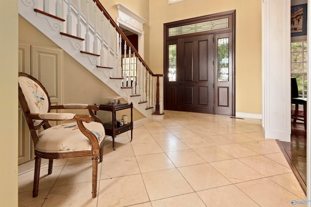 entryway featuring a healthy amount of sunlight and light tile patterned floors