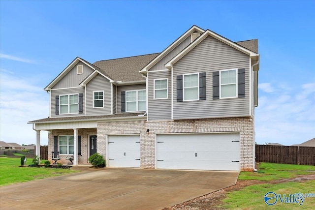 246 Tybee Dr, Madison, AL 35756 - view of front facade with brick siding, an attached garage, driveway, covered porch, and a shingled roof