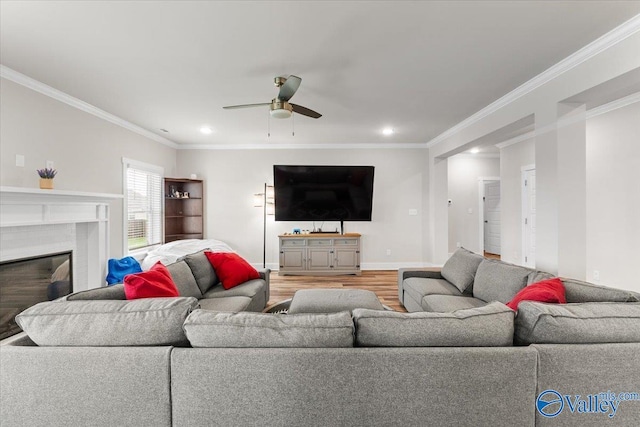 246 Tybee Dr, Madison, AL 35756 - living room featuring a ceiling fan, light wood-style flooring, recessed lighting, crown molding, and baseboards