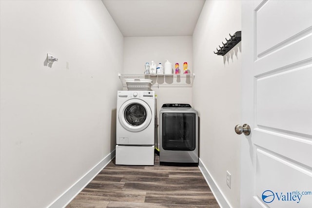 246 Tybee Dr, Madison, AL 35756 - laundry room with washing machine and dryer, dark wood-style flooring, and baseboards
