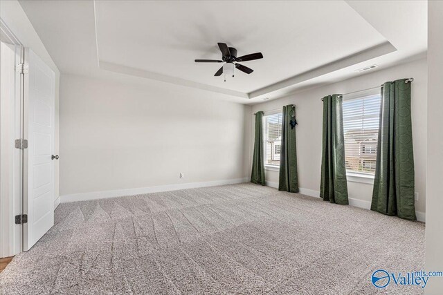 246 Tybee Dr, Madison, AL 35756 - empty room with a raised ceiling, a ceiling fan, baseboards, and carpet flooring