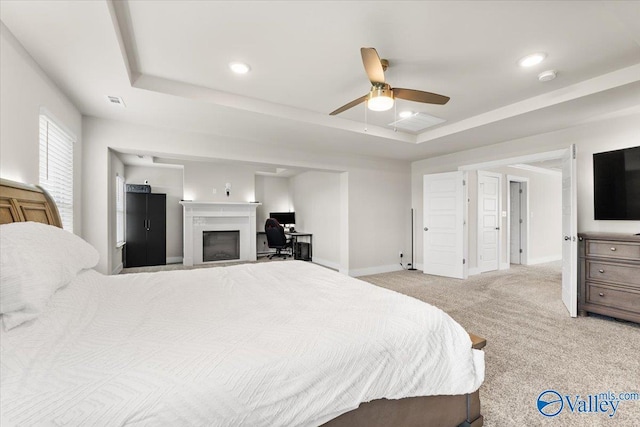 246 Tybee Dr, Madison, AL 35756 - bedroom with a tray ceiling, carpet, a fireplace, baseboards, and recessed lighting