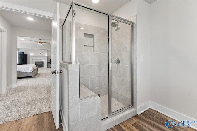 246 Tybee Dr, Madison, AL 35756 - bathroom featuring connected bathroom, a shower stall, ceiling fan, wood finished floors, and recessed lighting