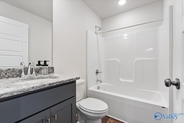 246 Tybee Dr, Madison, AL 35756 - full bathroom featuring toilet, vanity, shower / tub combination, and wood finished floors