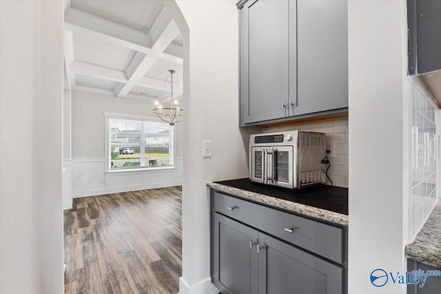 246 Tybee Dr, Madison, AL 35756 - kitchen with gray cabinetry, wood finished floors, coffered ceiling, beam ceiling, and a chandelier