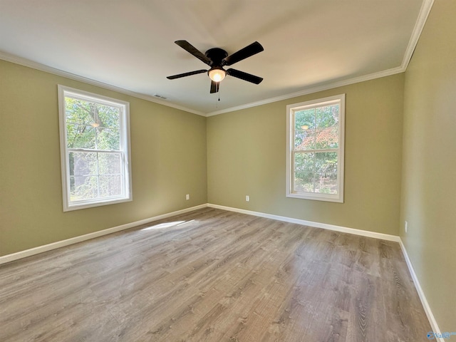 unfurnished room featuring crown molding, light hardwood / wood-style floors, and ceiling fan