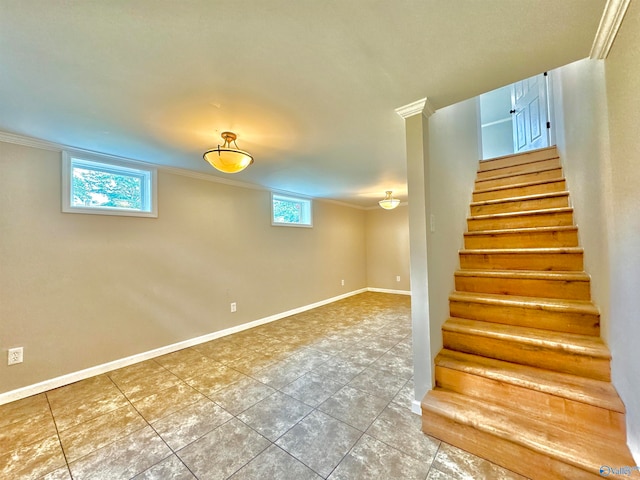 stairs with ornamental molding and a wealth of natural light