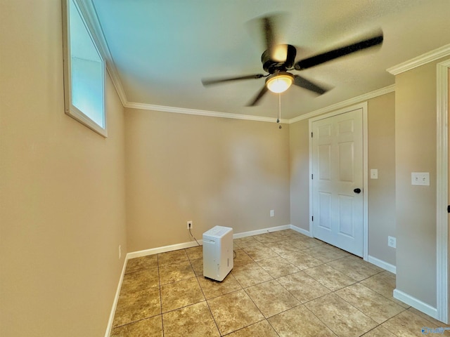 interior space featuring ornamental molding and ceiling fan