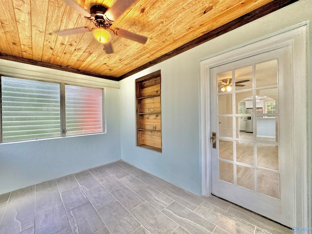 unfurnished room featuring wood ceiling and ceiling fan