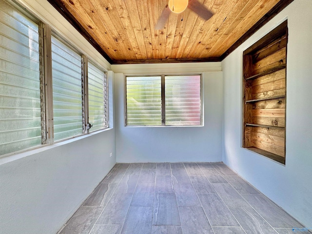 unfurnished room featuring ceiling fan, hardwood / wood-style floors, and wooden ceiling