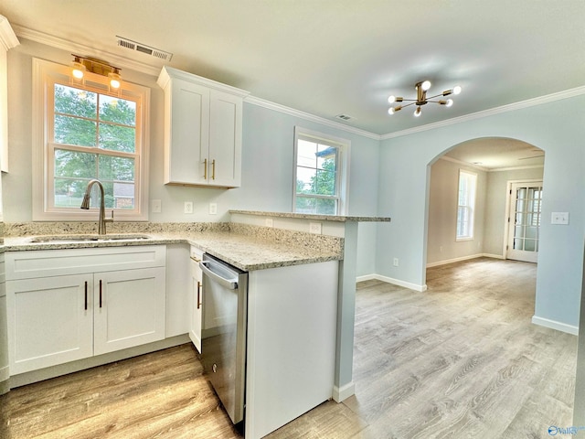 kitchen with white cabinets, dishwasher, light hardwood / wood-style floors, and a healthy amount of sunlight