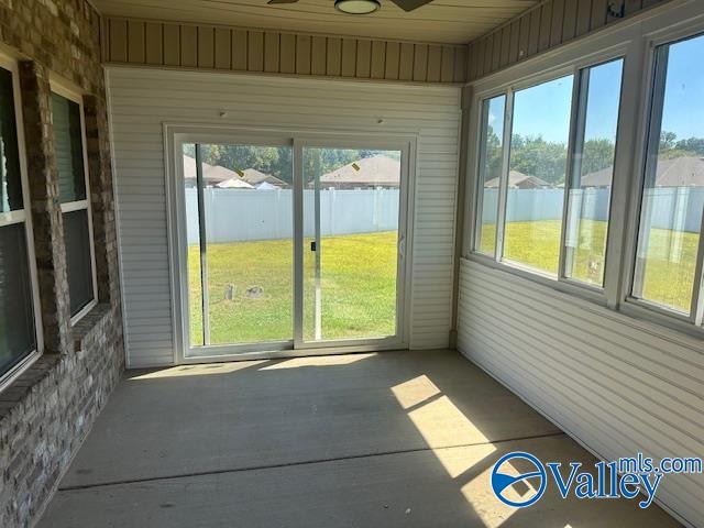 unfurnished sunroom with a wealth of natural light