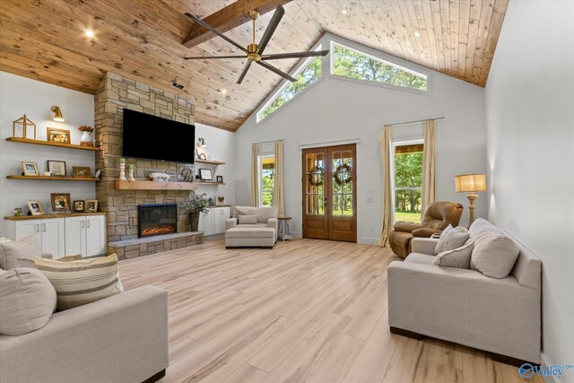 living room featuring high vaulted ceiling, beam ceiling, wooden ceiling, and light hardwood / wood-style floors