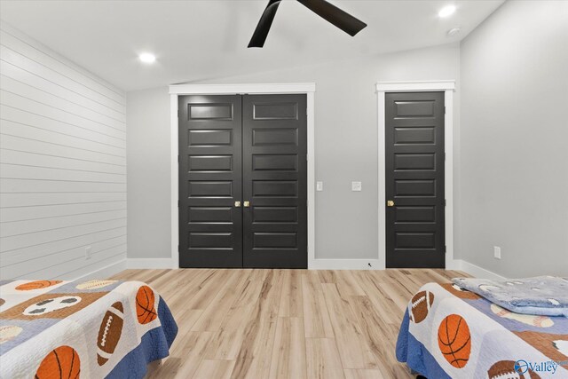 bedroom featuring light hardwood / wood-style flooring and ceiling fan