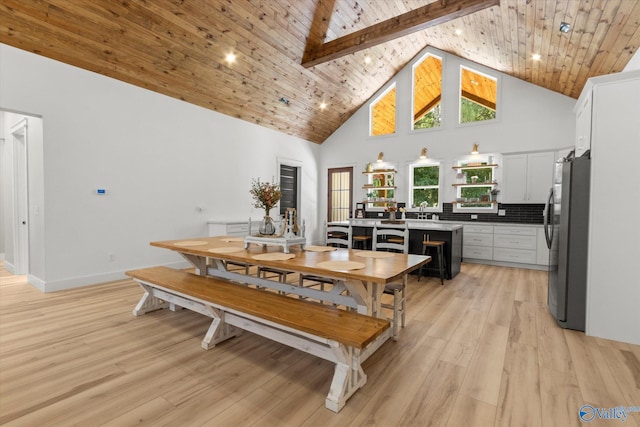 dining space featuring wood ceiling, high vaulted ceiling, light hardwood / wood-style flooring, beamed ceiling, and beverage cooler