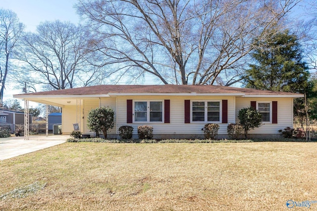 single story home featuring driveway, a carport, and a front yard