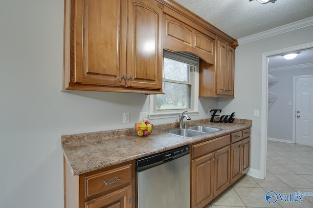 kitchen with sink, crown molding, dishwasher, a textured ceiling, and light tile patterned flooring