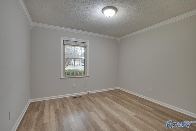 unfurnished room featuring crown molding, light hardwood / wood-style floors, and a textured ceiling