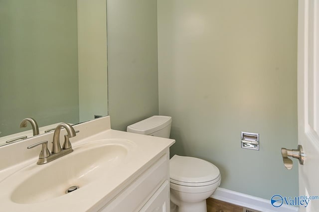 bathroom with vanity and toilet